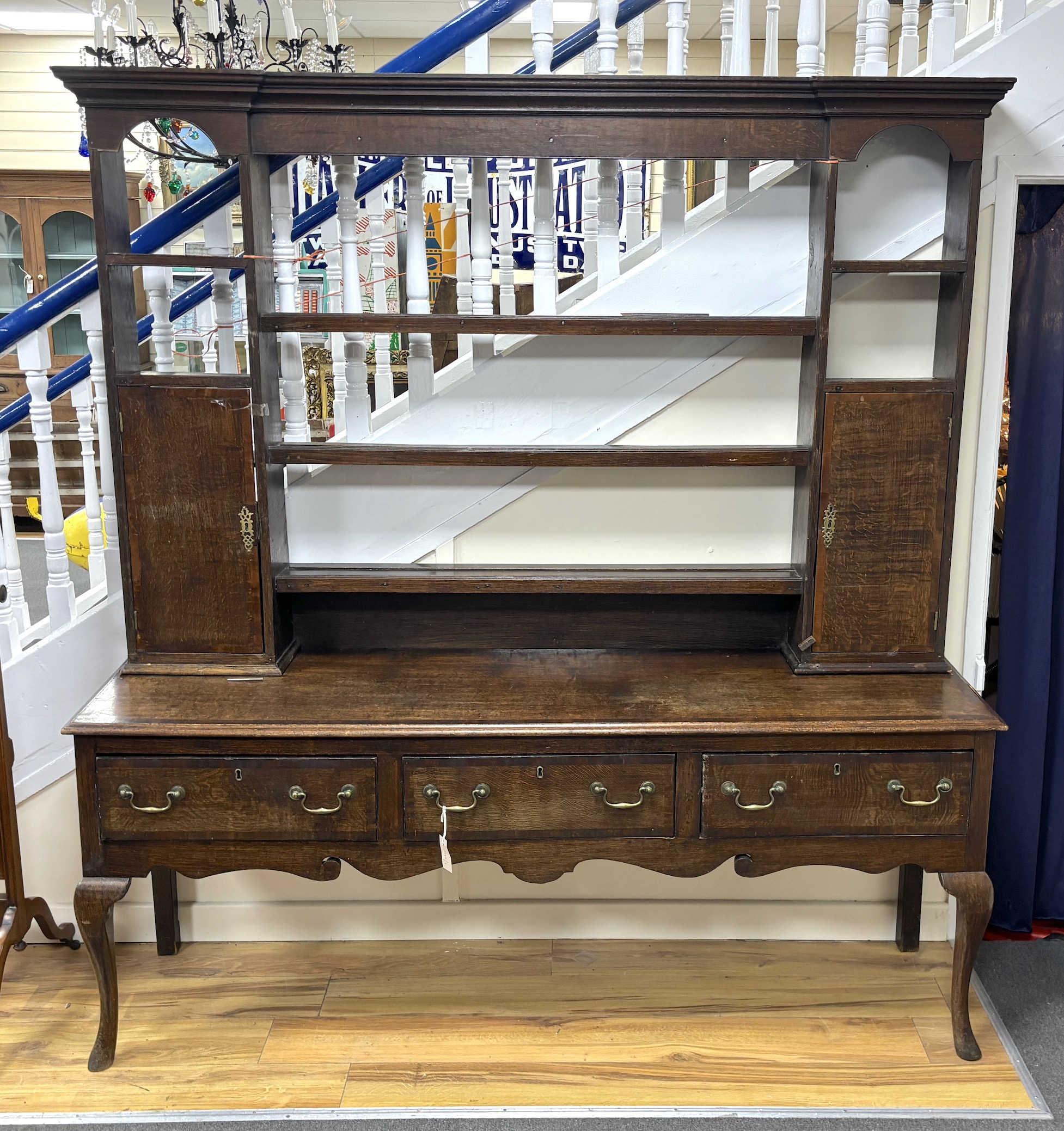 A George III mahogany banded oak dresser, with open rack, width 182cm, depth 48cm, height 195cm